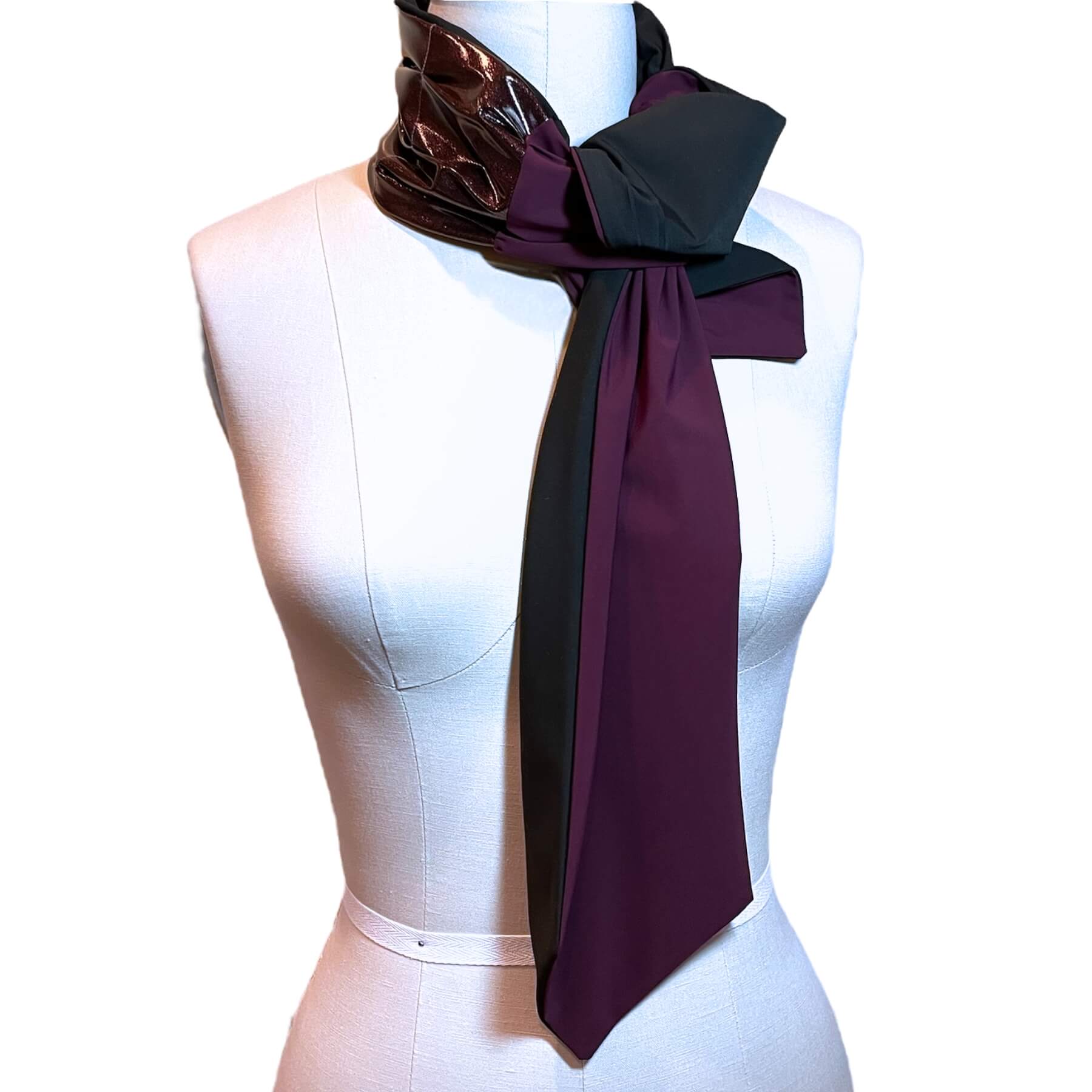 Sun protective scarf shown tied at neck on mannequin in orchid glitter glam rock with eggplant and black color on reverse