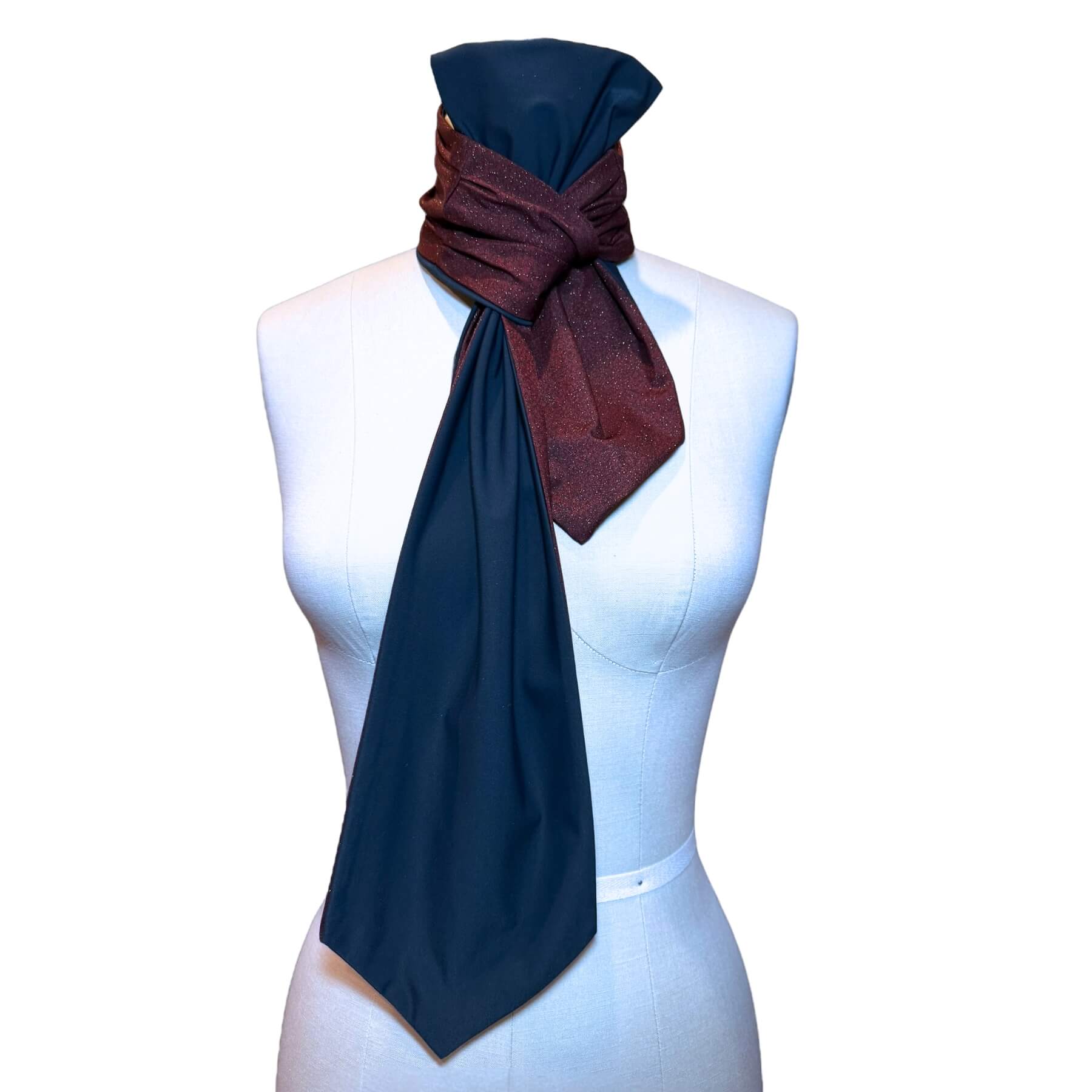 Sun protective reversible scarf shown on mannequin in merlot gold sparkle with navy blue on reverse.