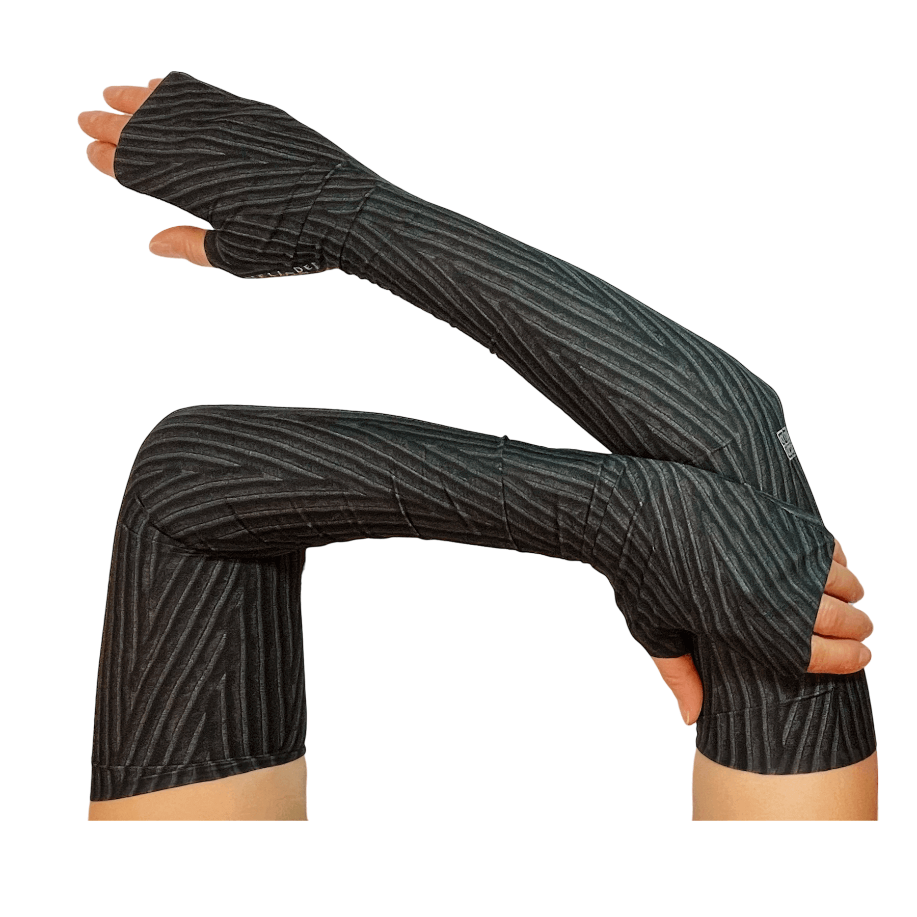 Stylish sleeves for sun protection shown in sleek black chevron chenille allover print hand crafted by Heliades