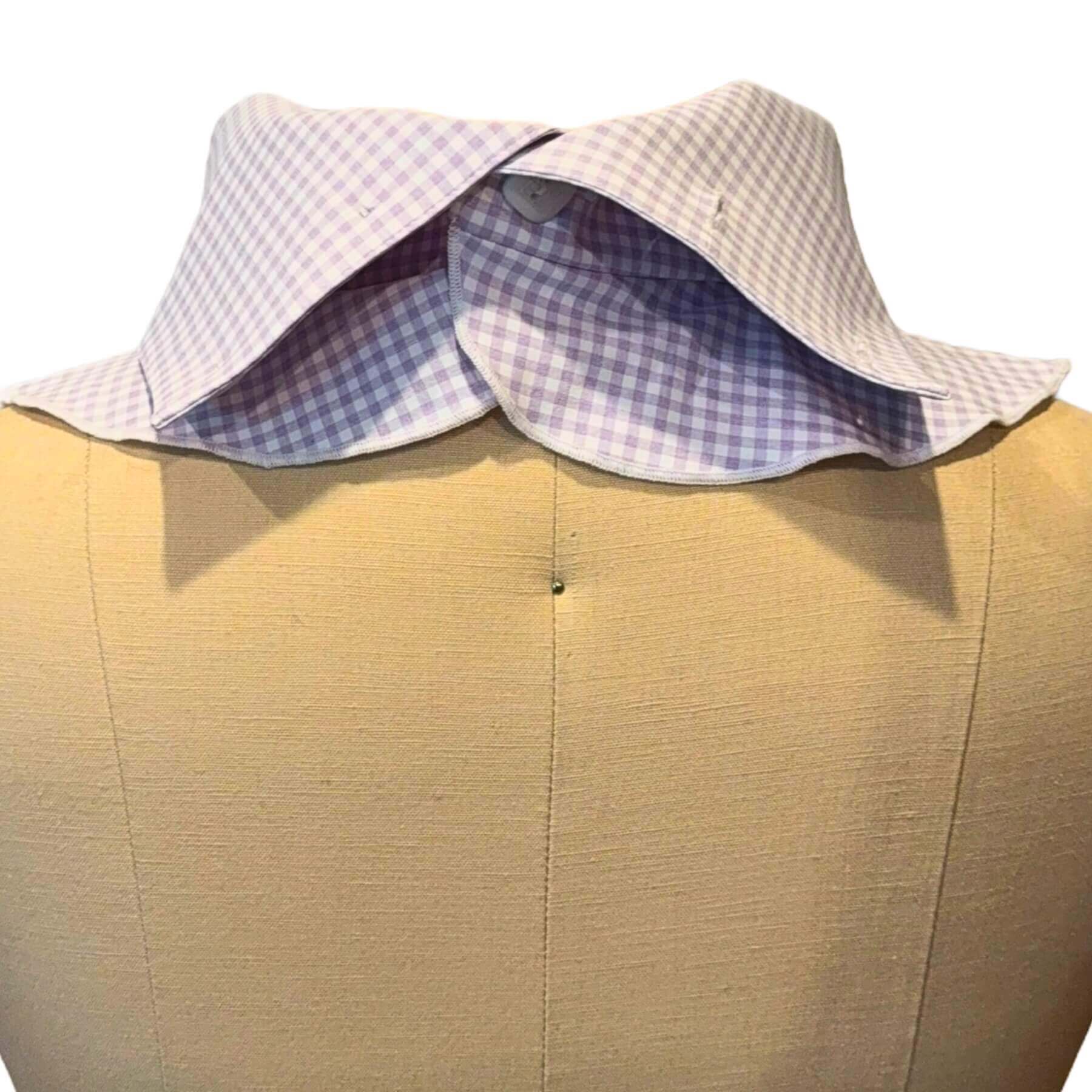 Back view of Heliades Sun Dickey shown with collar partially folded down and one button fastened.