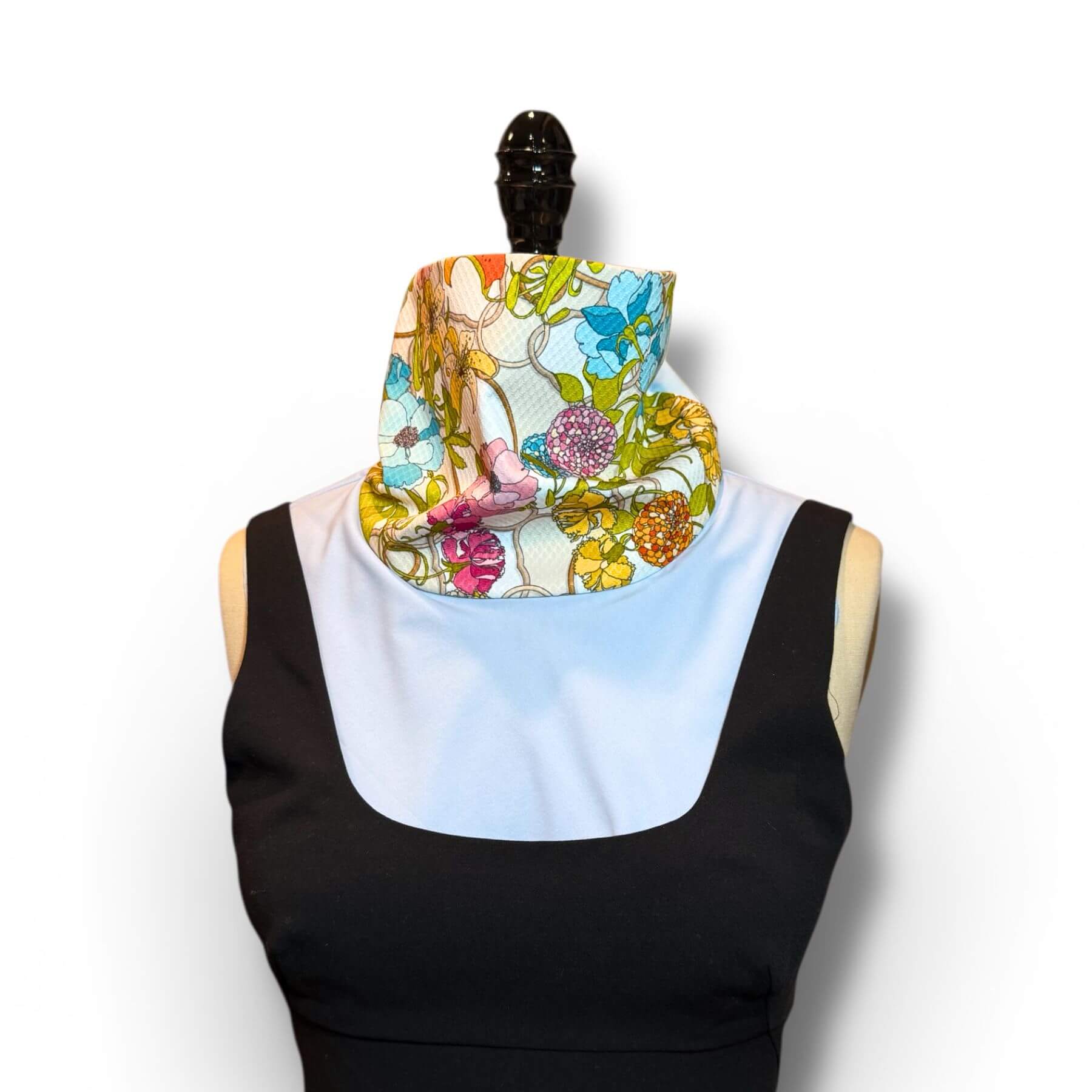 Sun Dickey worn with sleeveless black evening dress providing elegant neck and chest sun protection