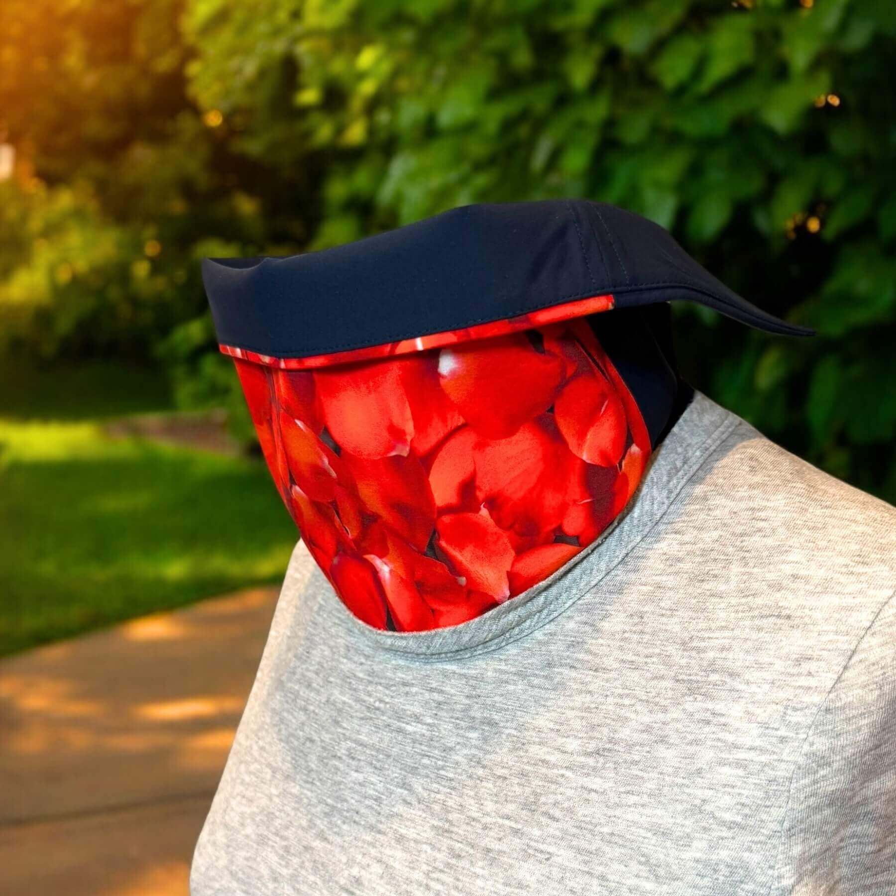 Side view of Sun Dickey shown in navy blue with red hydrangea petals print paired with gray t-shirt