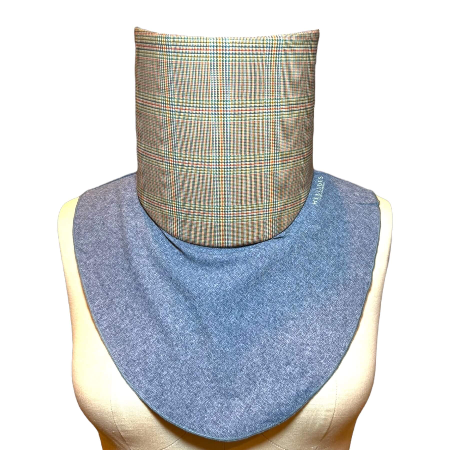 This sun scarf - a stylish Sun Dickey - is shown on a mannequin in blue melange with classic glenn plaid print in shades of yellow, blue, orange and green