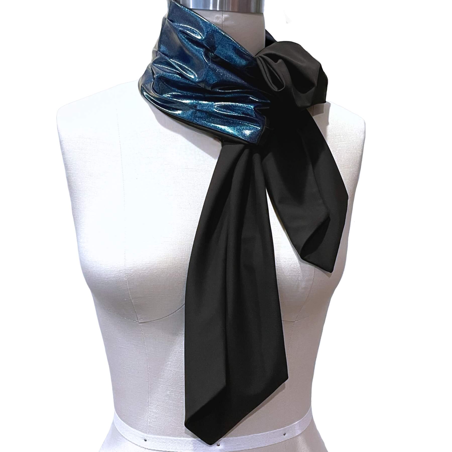 This glamorous, all season sun protective scarf is made by hand by Heliades in luxe, high end permanent UPF 50+ fabric in deep blue glitter with black on reverse