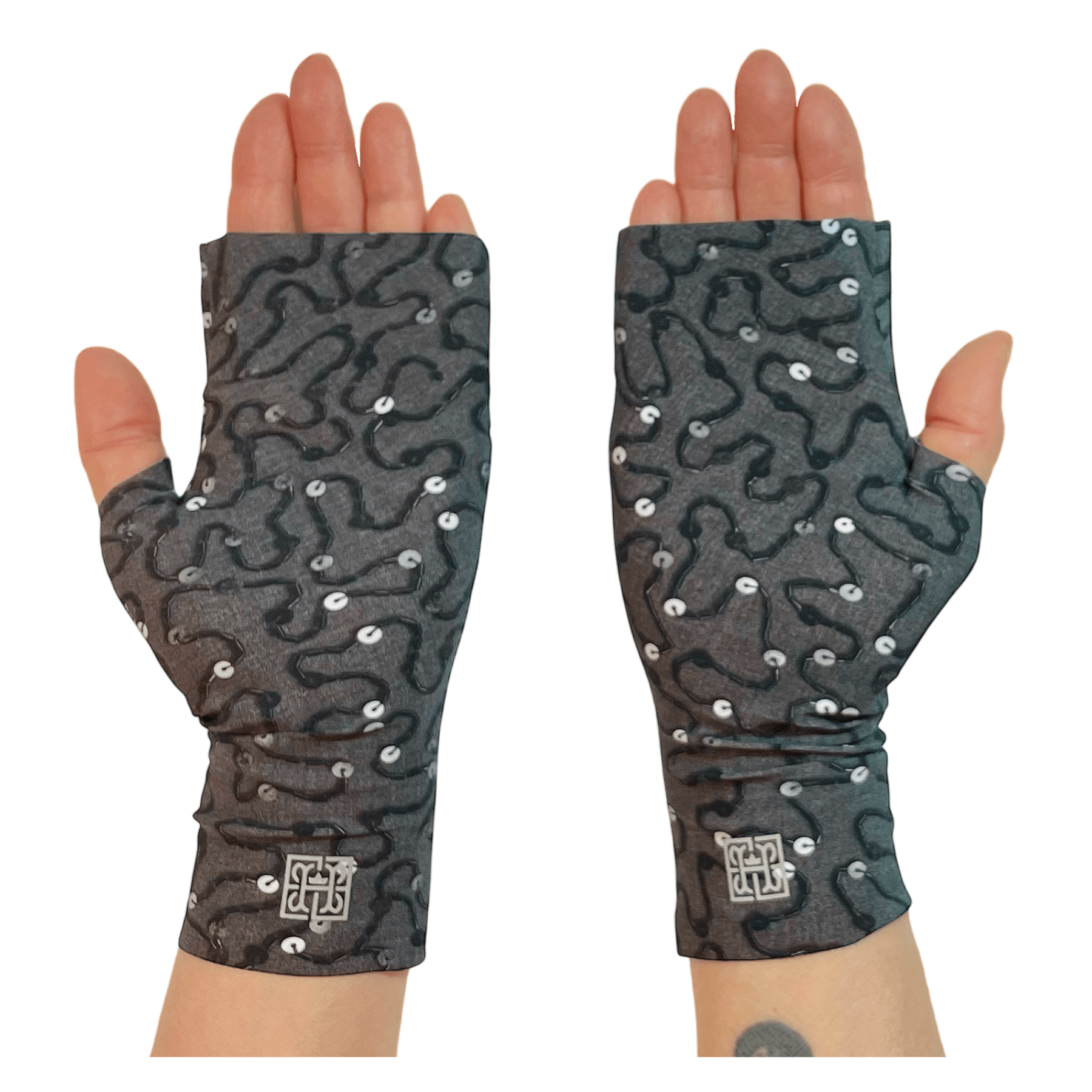 Back view of fierce UV protection gloves for driving with pretty print featuring black, silver and gray beads embroidered on gray fabric. With Heliades logo in reflective silver.