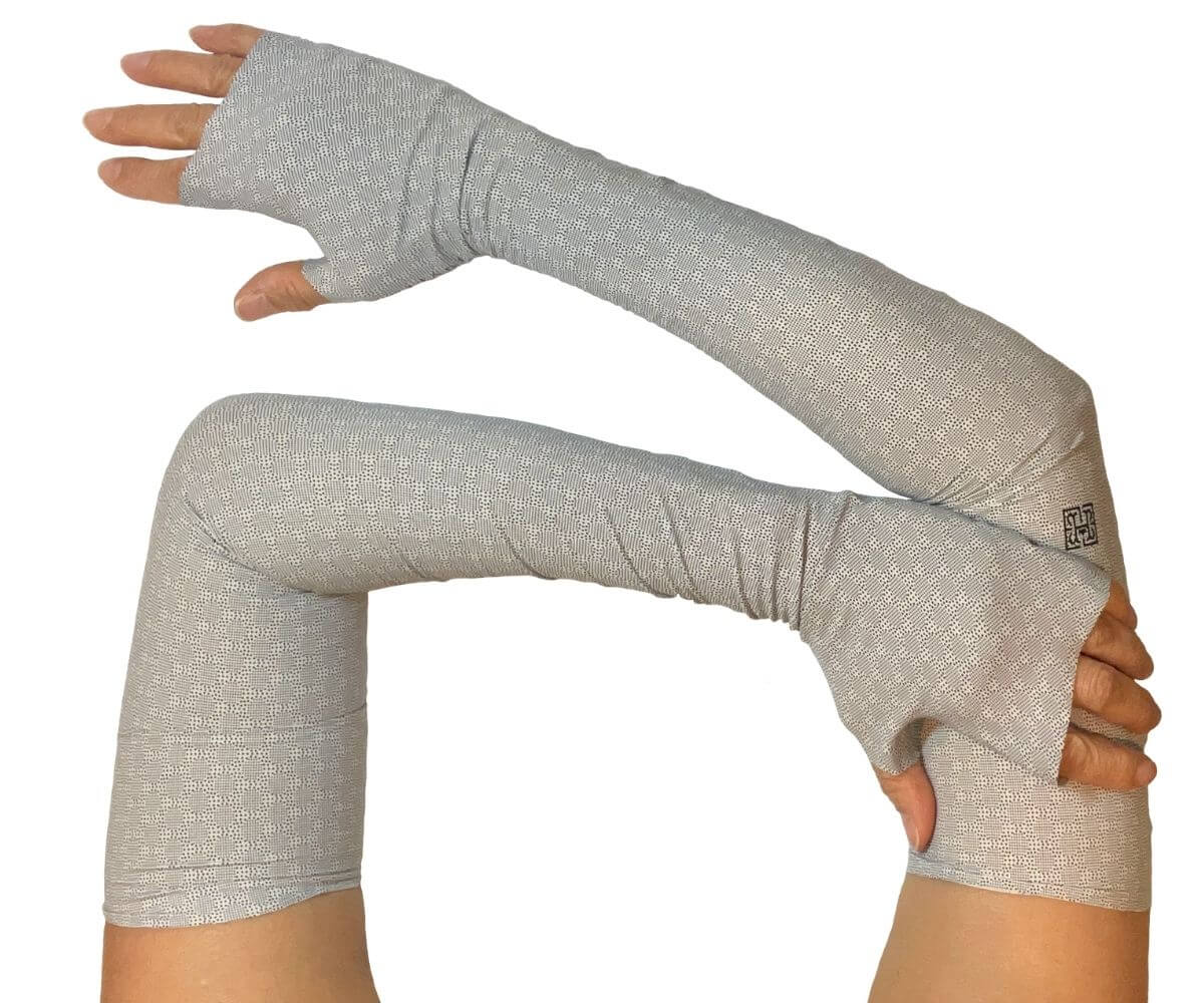 Heliades UPF 50 Sun Protective Clothing UV full length fingerless Arm Sleeves in fashionable beige and black allover print