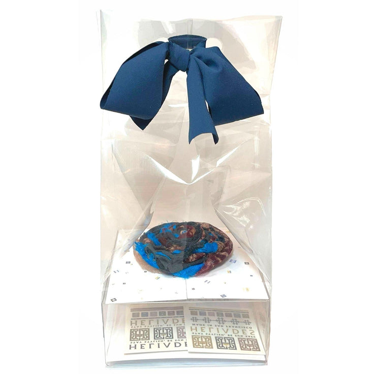 Easy, elegant DIY gift packaging kit shown fully assembled with clear cellophane bag, upcycled fabric ribbon cut from repurposed HELIADES fabric, branded clear packaging insert and two temporary tattoos. Blue and burgundy spirit flower sold separately.
