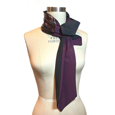 UPF 50+ Sun Protection scarf for Neck Chest decolletage UV Ray Coverage shown styled as scarf tie at neck, color is orchid glitter glam rock with eggplant purple and solid black on reverse side.