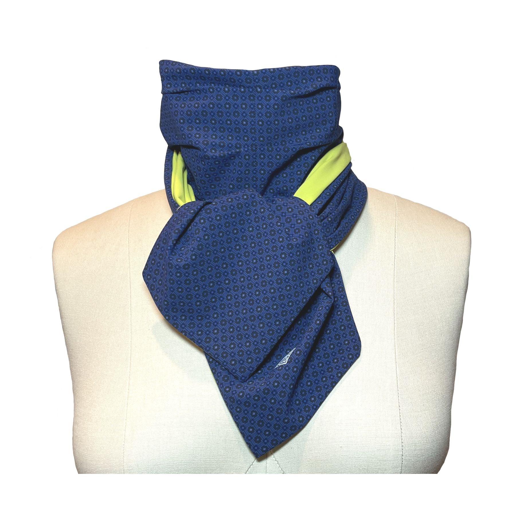 UPF 50+ Sun Protection scarf shown styled as Bridgerton Cravat Tie, color is chartreuse, reversible side is tanzanite blue rosette in repeating pattern.