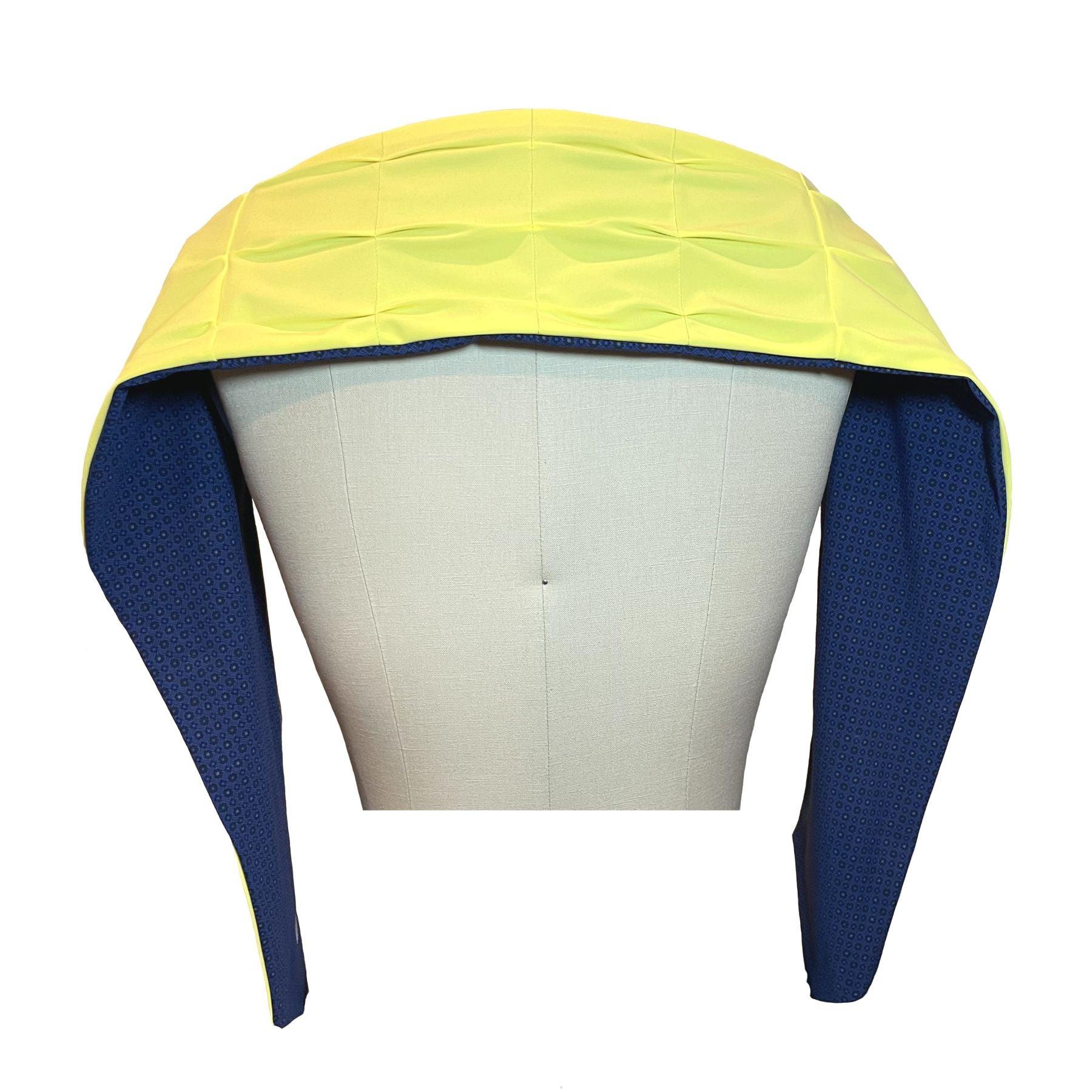 UPF 50+ Sun Protection scarf shown styled as shawl over shoulders, color is lemon custard yellow, reversible side is tanzanite blue rosette