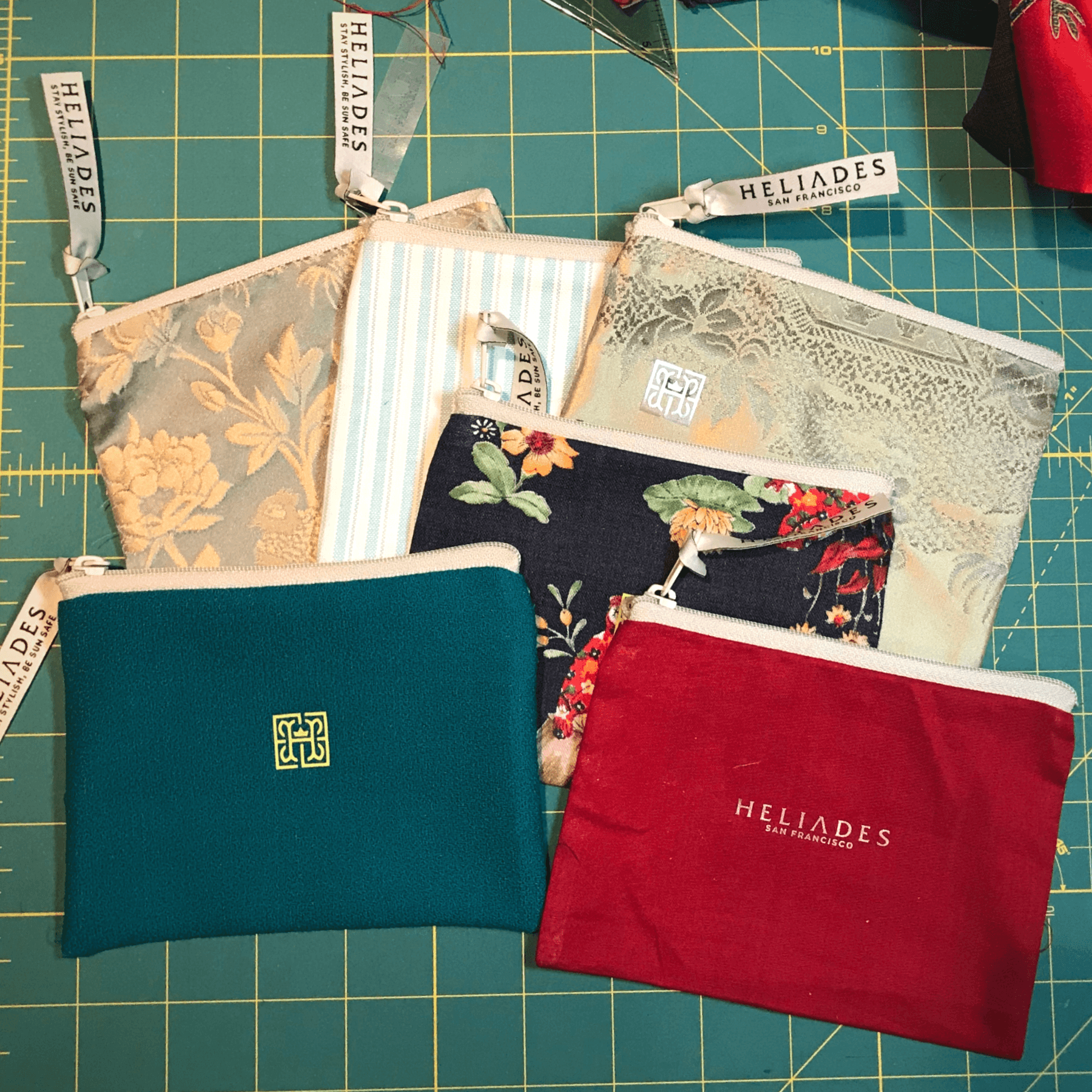 Heliades upcycled zippered pouches provide cute storage for UV Sun Gauntlets. Free with purchase while supplies last.