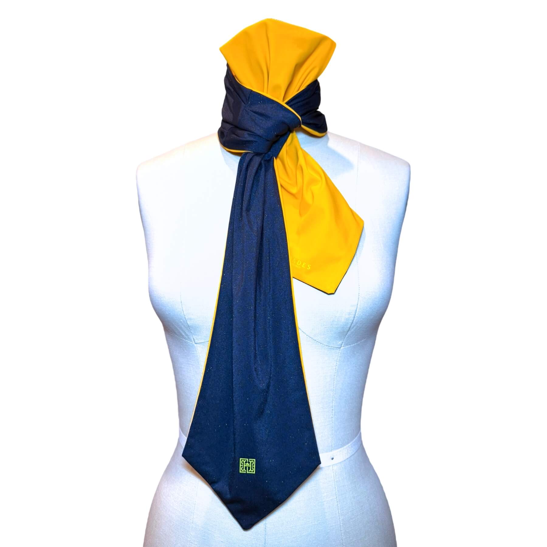 Pretty, versatile, reversible sun scarf shown on mannequin in sapphire blue sparkle with marigold color on reverse.
