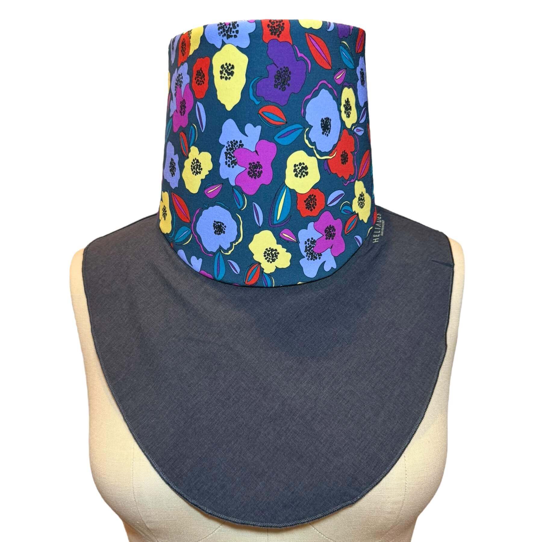 Stylish neck sun cover: The fashion Sun Protection Dickey is shown in charcoal gray melange with blue, purple, violet, red and yellow flower print