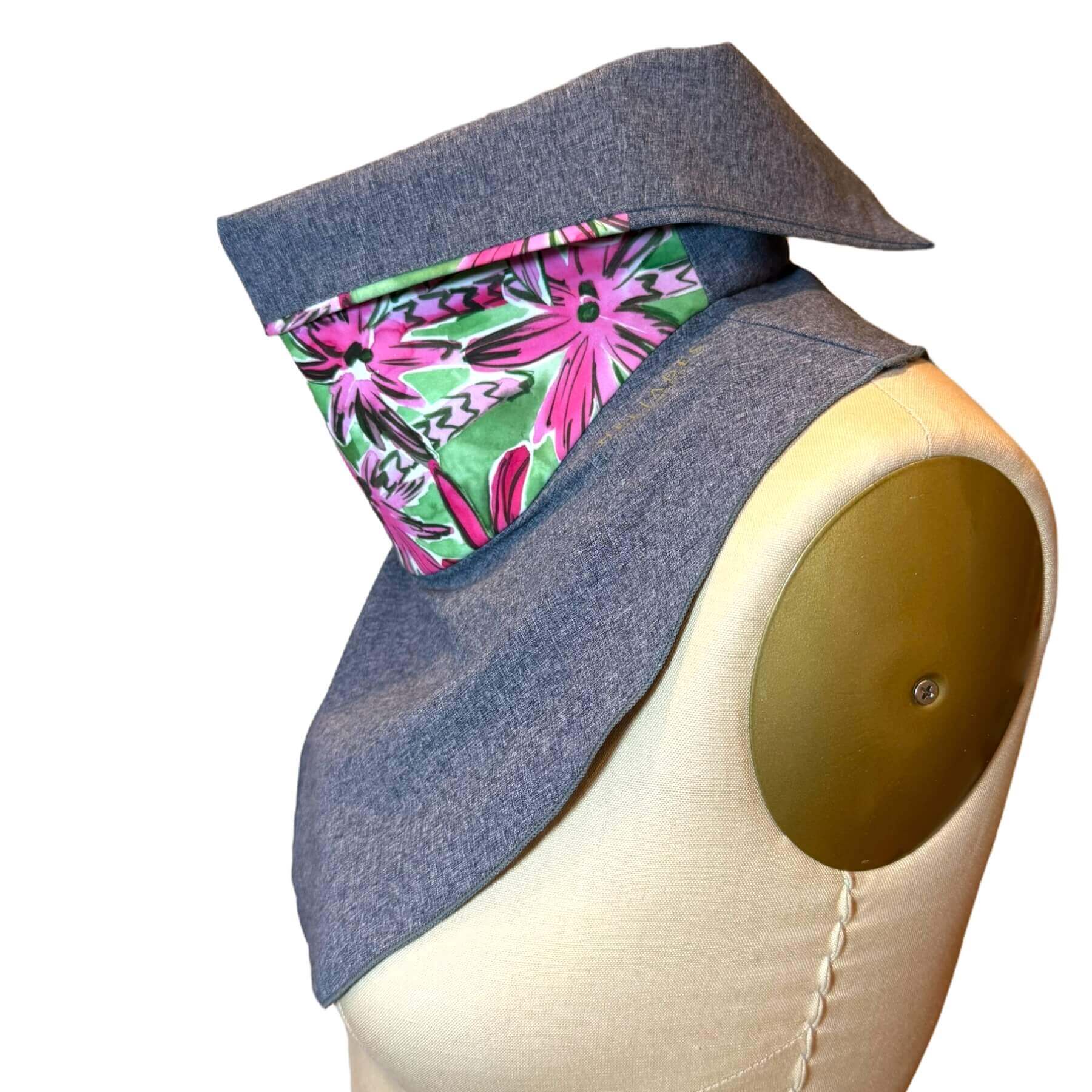 Side view of Sun Dickey shown in blue melange with vibrant fashion print in green with bright pink palm trees