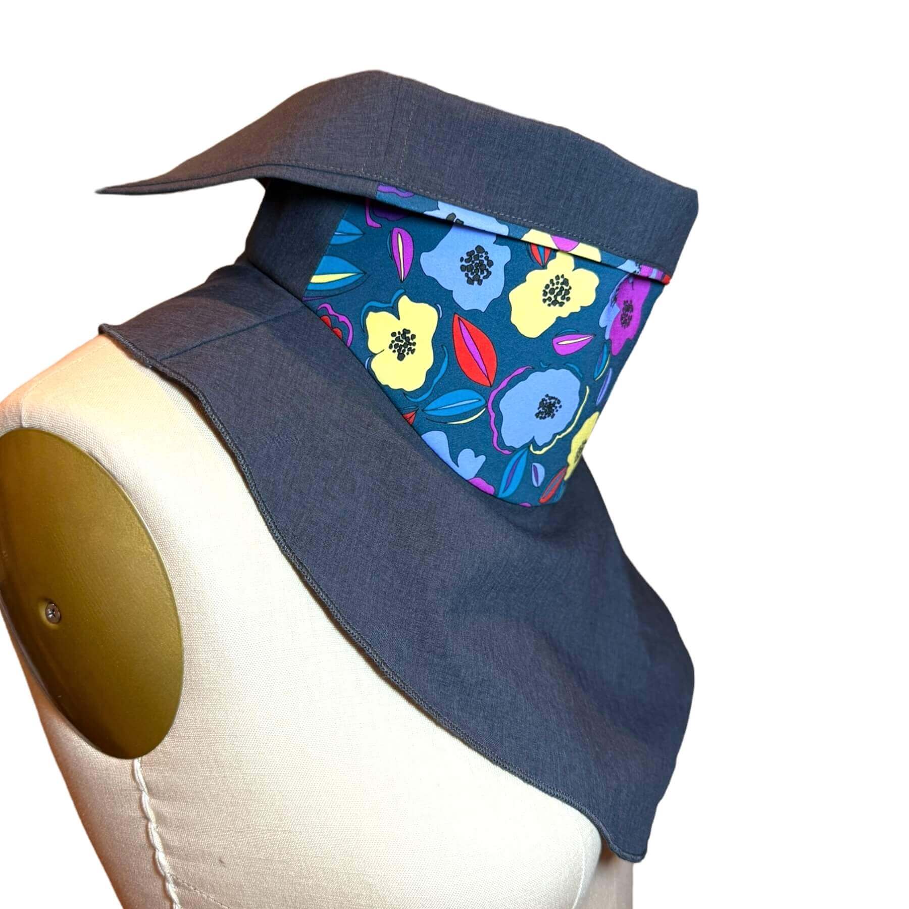 Side view of the stylish Sun Dickey shown in charcoal gray melange with blue, violet, yellow and red floral print