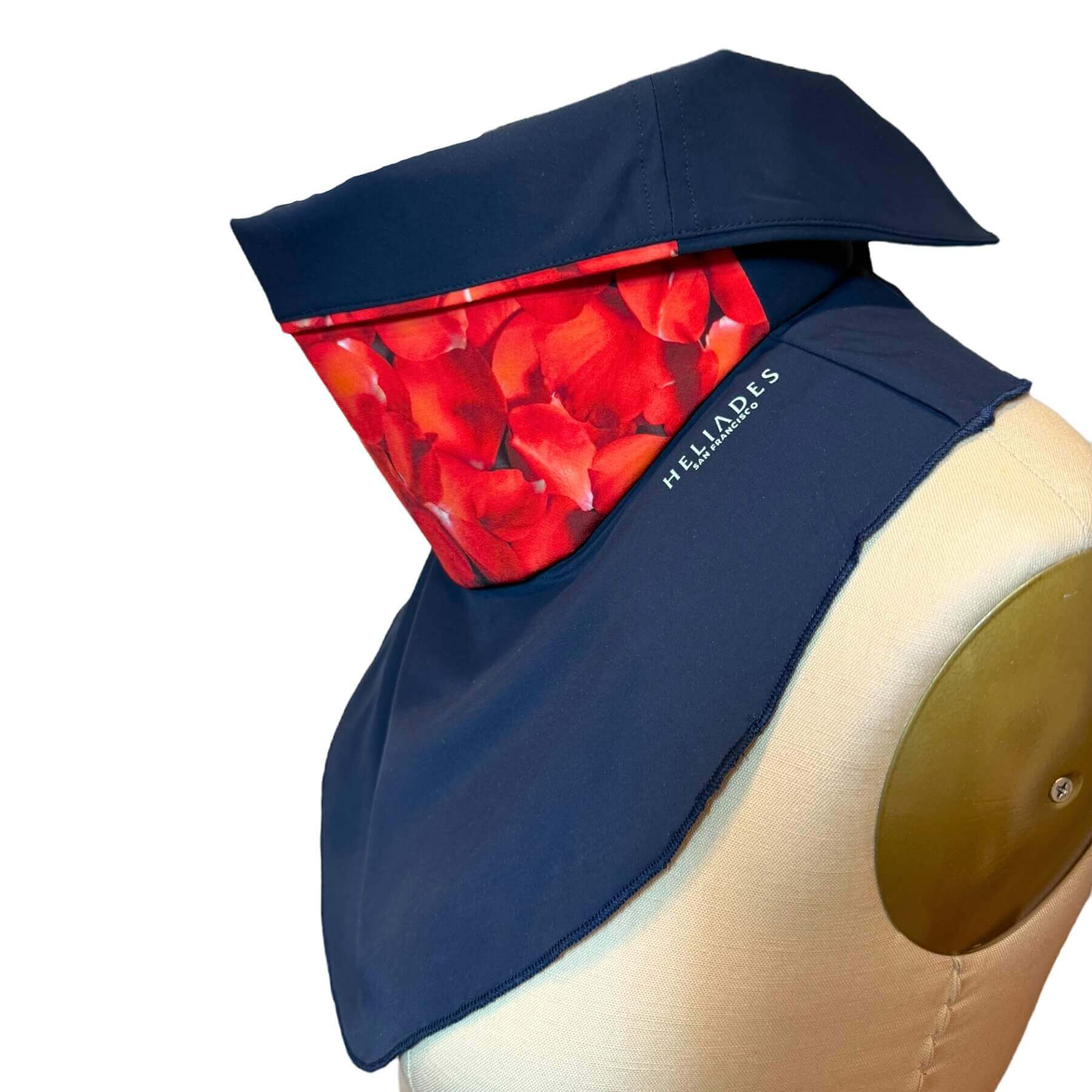 Side view of fashion Sun Dickey shown in navy blue with red hydrangea petal print.