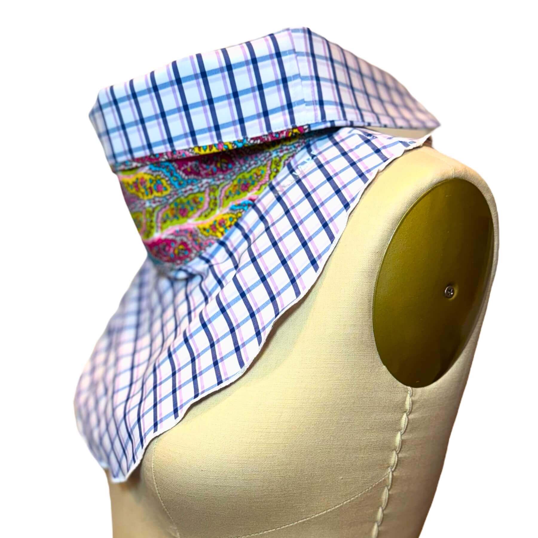 Side view of Sun Dickey shown with collar folded in blue, white plaid with pink, blue, green paisley print colorway.