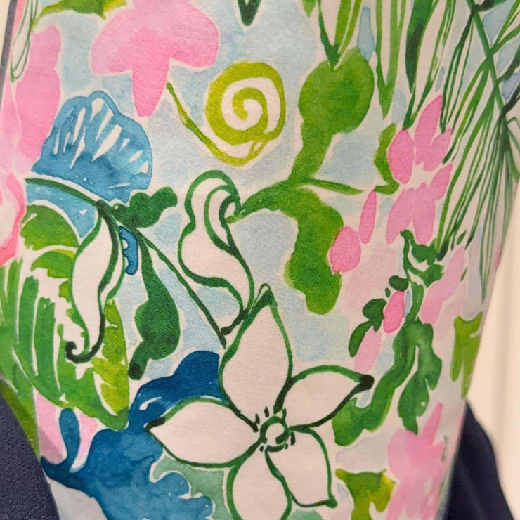 Heliades Fashion UPF50+ fabric swatch in pink, blue, green floral print on white background
