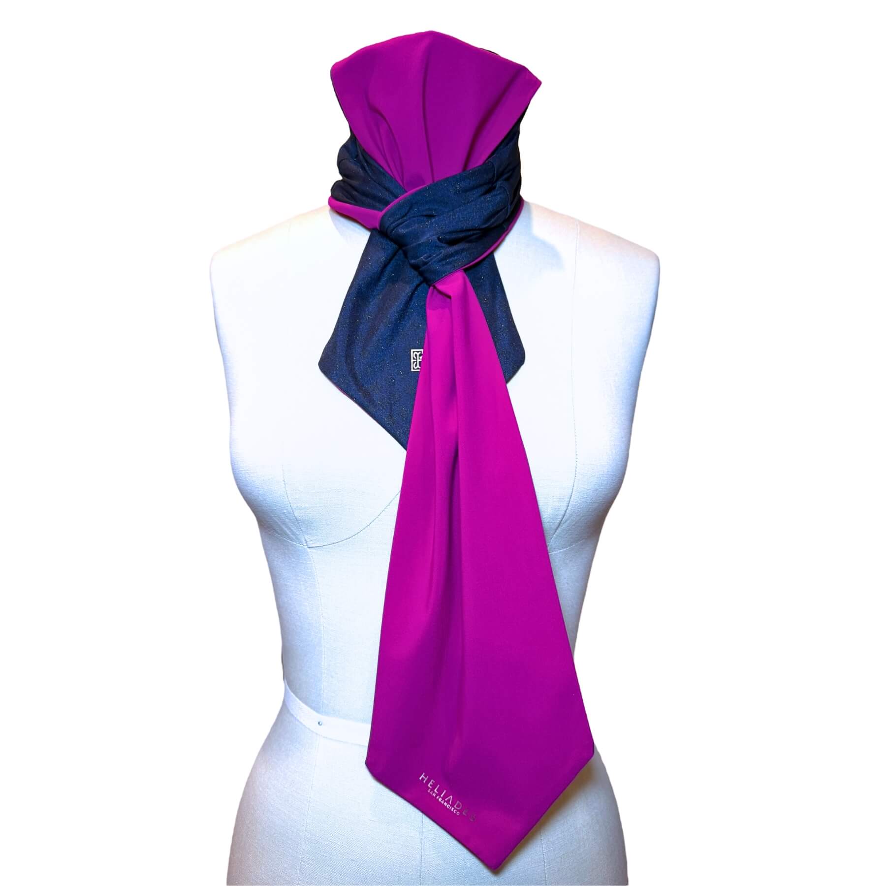 Sun protective scarf shown on mannequin in sapphire blue sparkle with fuchsia color on reverse