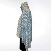Side view of the Gray Plaid UV Shoulder Wrap showing elegant drape in plaid UPF 50+ sun protective fabric.