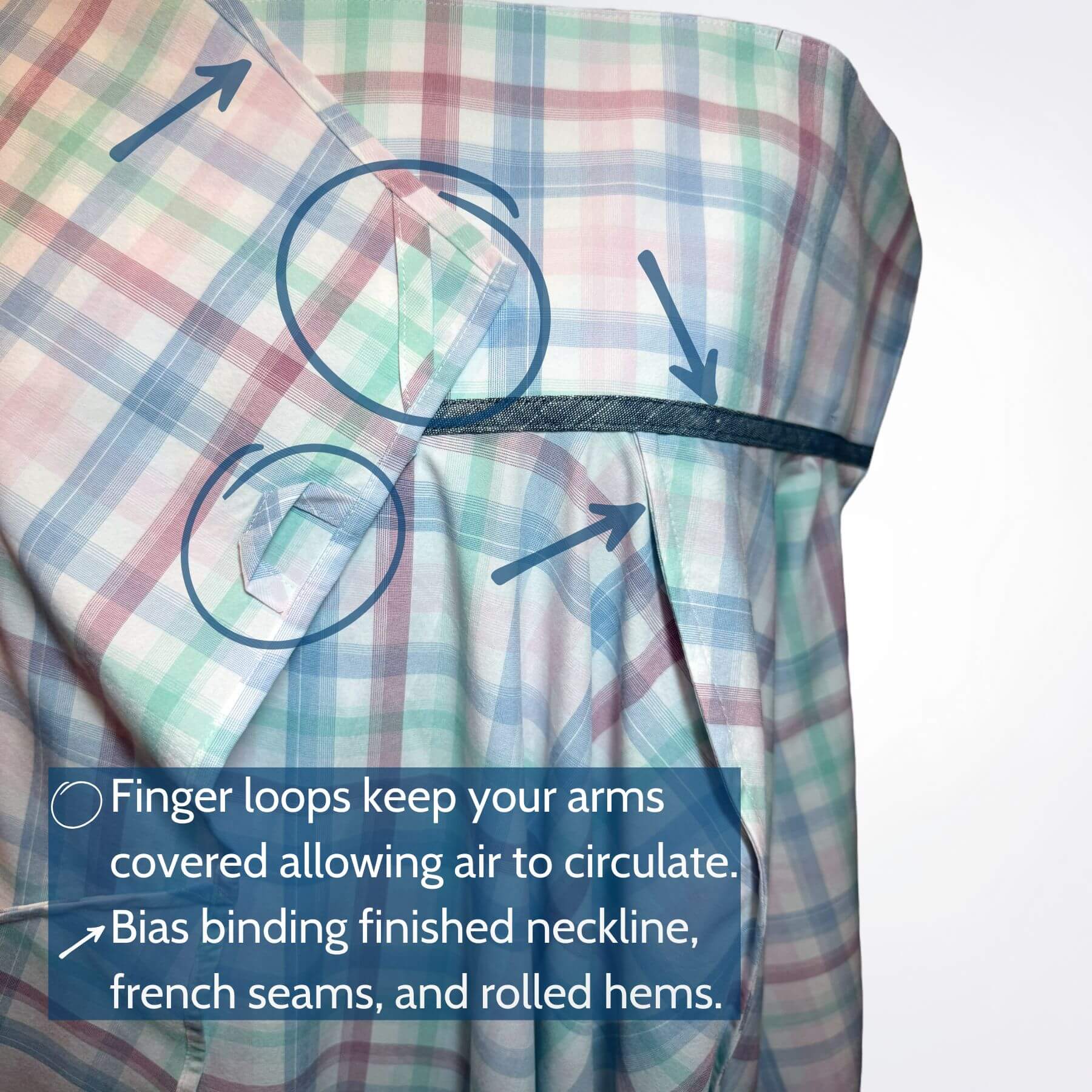 Close-up of Pastel Plaid UV Protection Shawl fabric details showing French seams, finger loops, and bias binding in soft plaid UPF 50+ material.