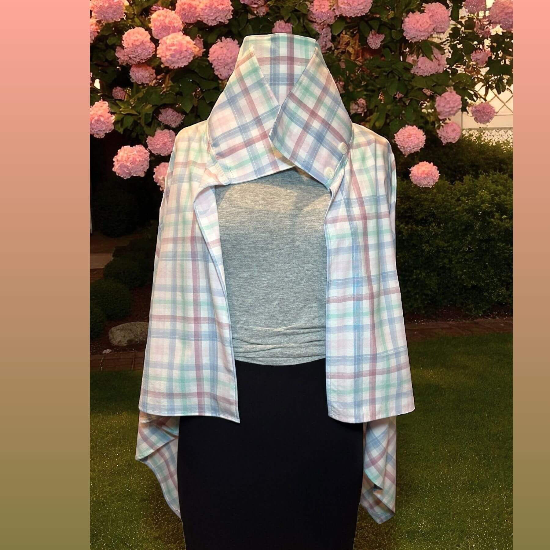 Lifestyle view of the Pastel Plaid UV Protection Shawl worn outdoors, stylish pastel plaid UPF 50+ fabric for elegant sun safety.