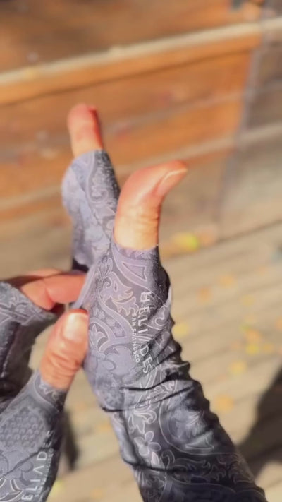 Heliades Sun Gauntlets are chemical-free UPF 50+ sun protective arm sleeves and gloves. Shown on arms, made by hand, and worn daily with everyday outfits during outdoor activities - video.