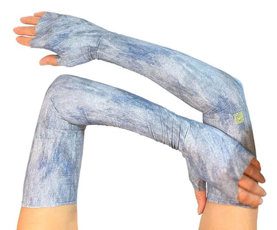 HELIADES UPF50+ sun protective full length UV arm sleeves in blue jean denim all over print with blue, light blue and gray jean colors. Covers hands and is fingerless, tagless, seamless.