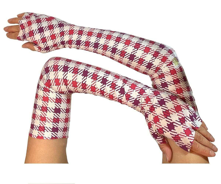 Heliades UPF 50 Sun Protective Clothing UV Arm Sleeves in fashionable houndstooth plaid print with red, purple, pink and beige colors. Full length UV sleeves cover hands, and are fingerless, tagless, seamless.