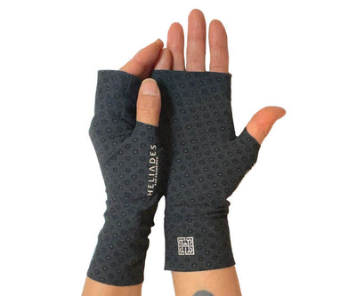 Heliades UPF 50 Sun Protective Clothing UV driving gloves in fashionable allover subtle rosette print with dark gray, black colors. These hand gloves are fingerless and seamless