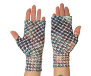 Heliades UPF 50 Sun Protective Clothing lightweight UV sun gloves in stylish patterned fabric. Shown is fashionable, elegant allover painterly plaid print with blue, purple, green colors. UV sun covered hands shown with pink metallic logo trim