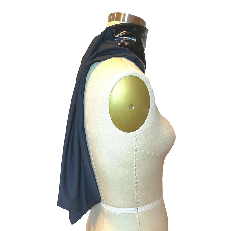 Heliades UPF 50+ Sun Protection scarf for Neck Chest decolletage UV Ray Coverage shown styled as long neck scarf, color is deep black glitter, reversible side is black solid color pattern.