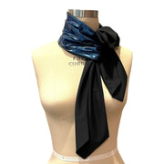 This glamorous, all season sun protective scarf for neck and chest coverage is made by hand by Heliades in luxe, high end, permanent UPF 50+ fabric in deep blue glitter with black.