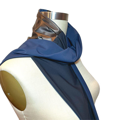 Heliades UPF 50+ Sun Protection scarf for Neck Chest decolletage UV Ray Coverage shown styled as Bridgerton Cravat Tie, color is bronze metallic and black, reversible side is true navy blue solid color.