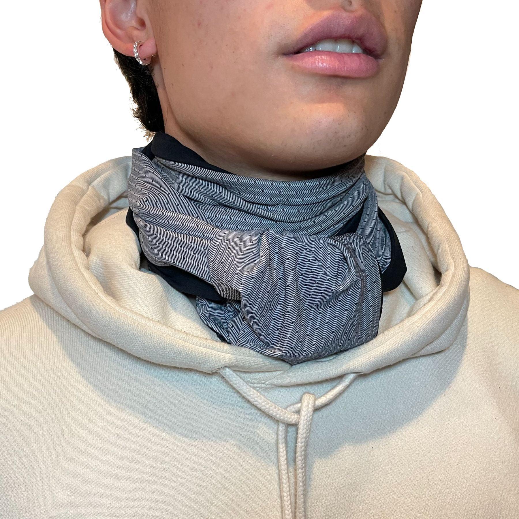 Gender neutral, unisex Heliades UPF50+ sun protective scarf in gray and black pinstripe. For UV sun coverage of neck, chest, décolletage