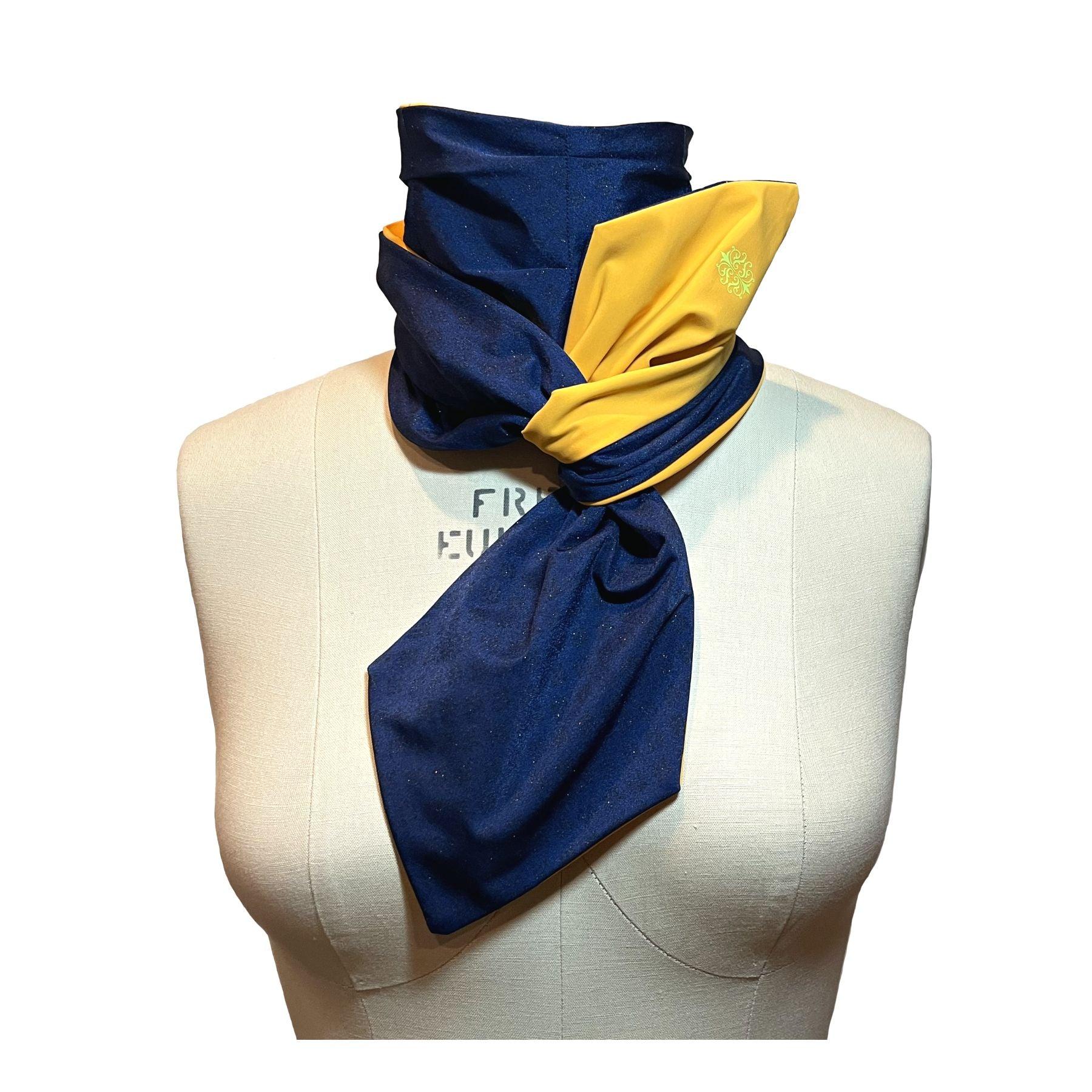 UPF 50+ Sun Protection scarf shown styled as Bridgerton Cravat Tie, color is marigold orange with pink constrast stitching and neon green trim, reversible side is sapphire blue with gold sparkles