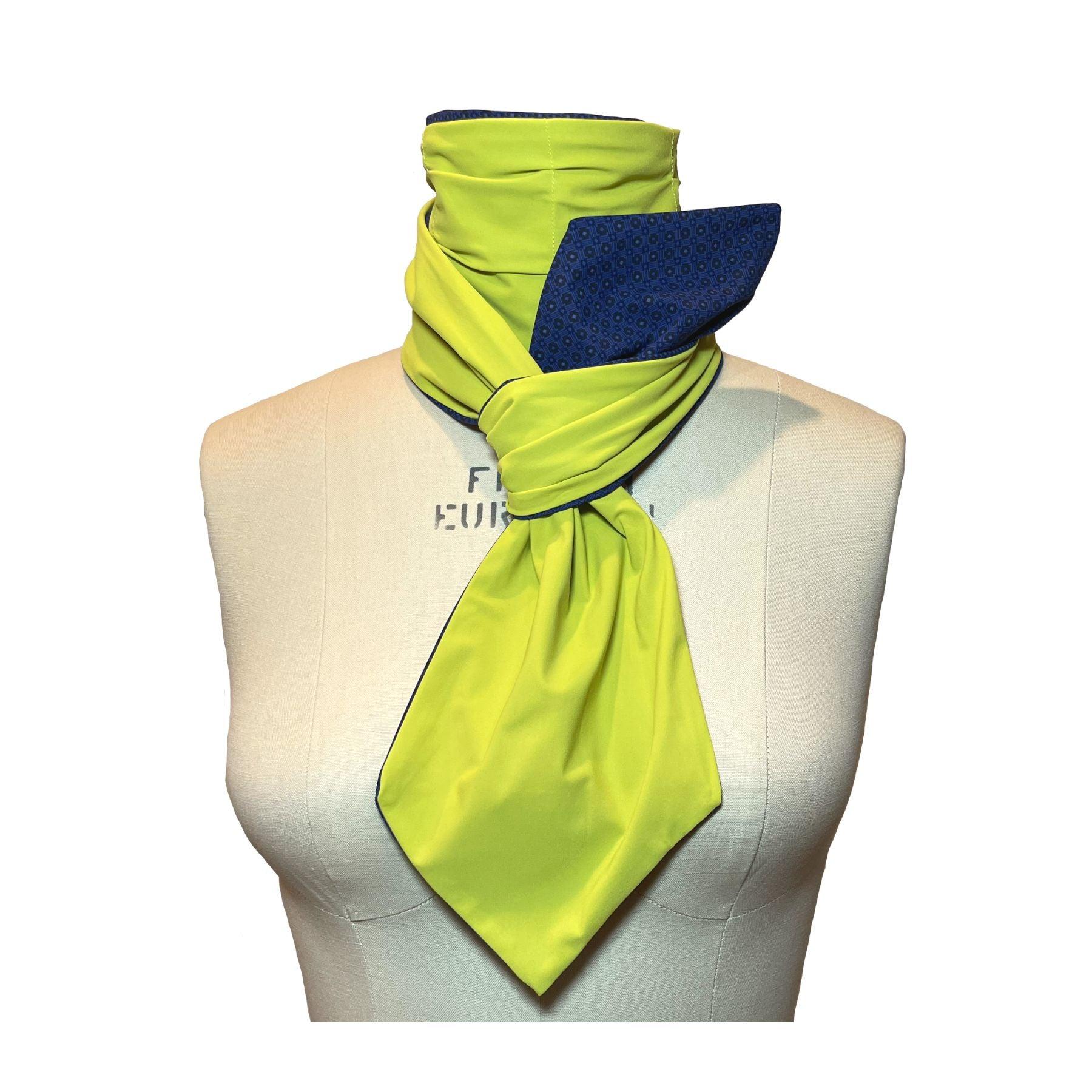 UPF 50+ Sun Protection scarf shown styled as Bridgerton Cravat Tie, color is chartreuse, reversible side is tanzanite blue rosette in repeating pattern.
