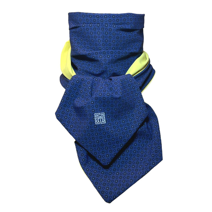 UPF 50+ Sun Protection scarf for Neck Chest decolletage UV Ray Coverage shown styled as Bridgerton Cravat Tie, color is lemon custard yellow, reversible side is tanzanite blue and black rosettes in repeating pattern.