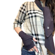 Woman wearing Burberry check shirt and jeans. A hand rests on jeans pants pocket. On hand is best UPF 50+ sun protective fingerless sun gloves in Burgundy Reddish Brown repeating rosette print made of UPF50+ and OEKO-TEX certified fabric. HELIADES logo shown, Made in USA. Around neck is UPF50+ reversible scarf, one side is Burgundy repeating rosette print, the other side is solid color true navy blue.